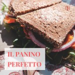 Sandwich di pane integrale con rucola, pomodoro e cipolla rossa